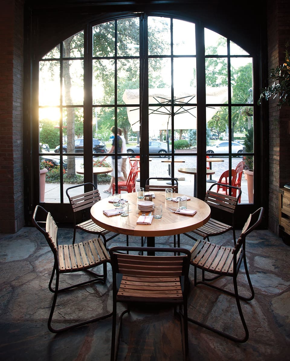 Grove Stand: Euro- SMASH at Prato 2 A table set for six overlooks a bustlingWinter Park shopping district; Photography by Michael Pisarri