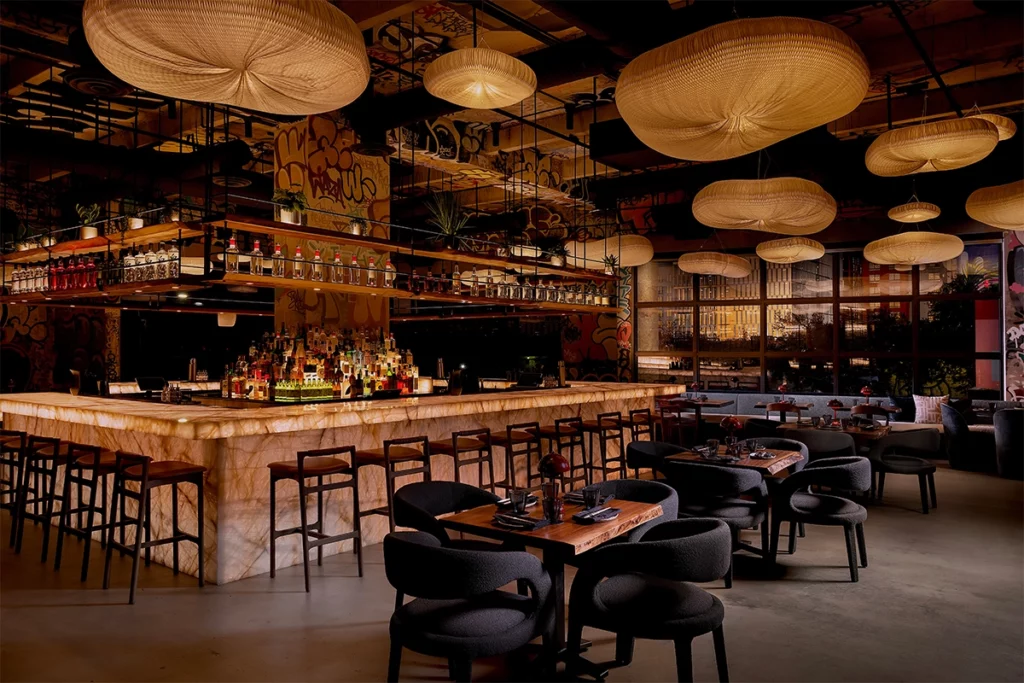 Shiso's interior design reflects Winwood's evolution, incorporating graffiti to represent the neighborhood's roots and an open, elevated concept to portray its future.