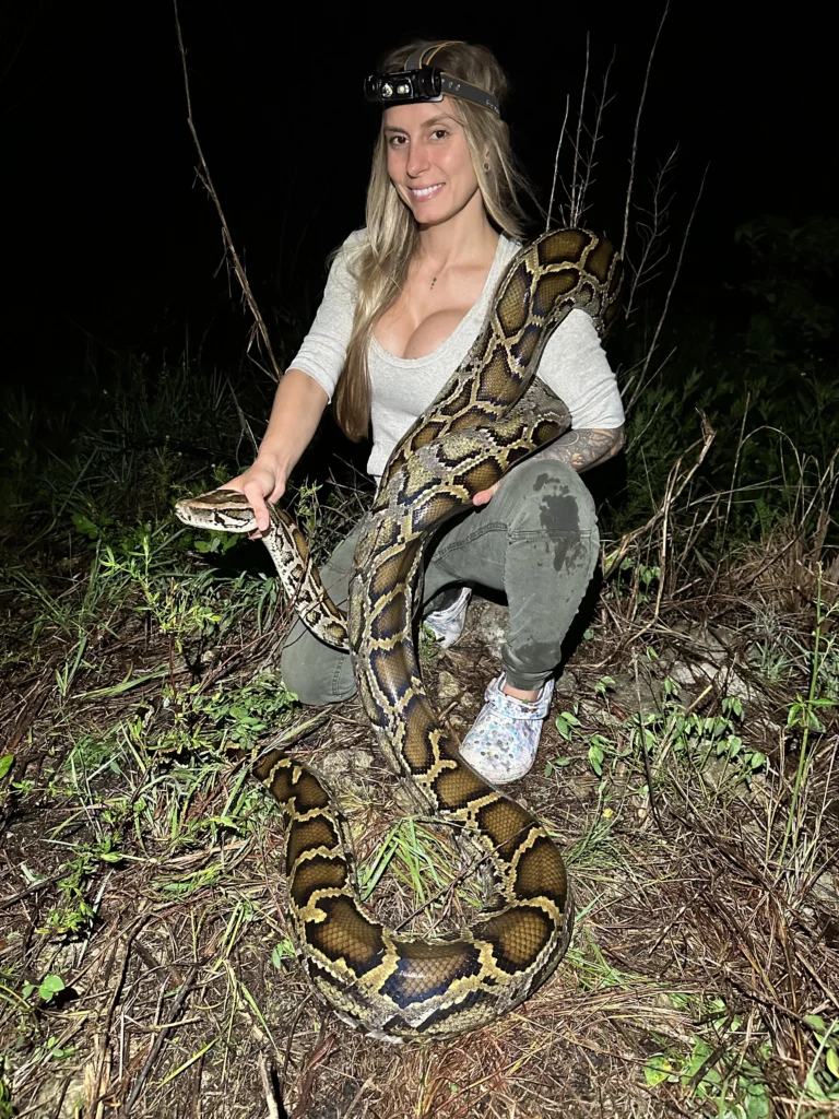 At 29, She's the First Woman to Win Florida's Python Challenge 1 Taylor Stanberry holding a python