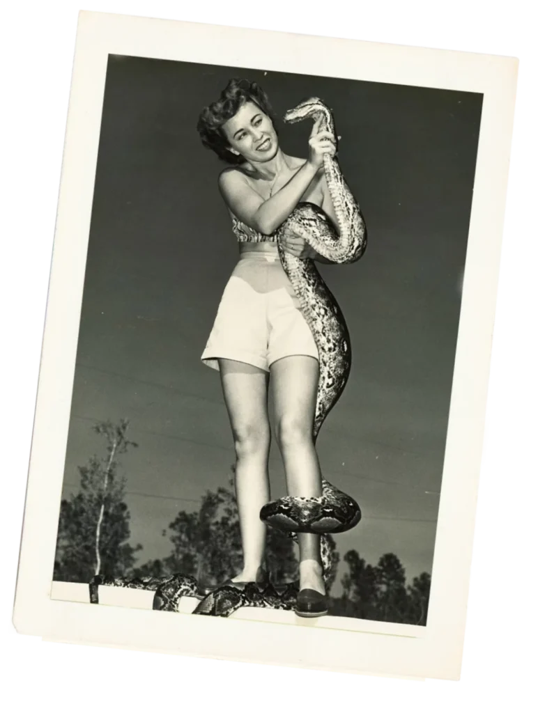 Clarita Haast and a python at the serpentarium.