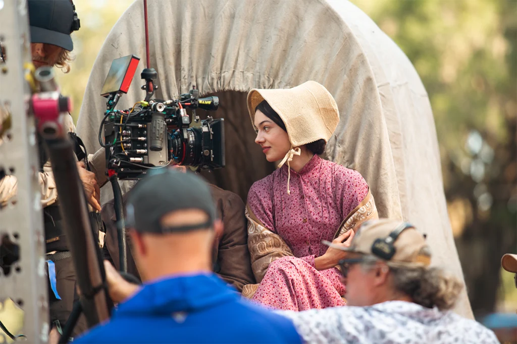 Filming "A Land Remembered" with girl facing camera.