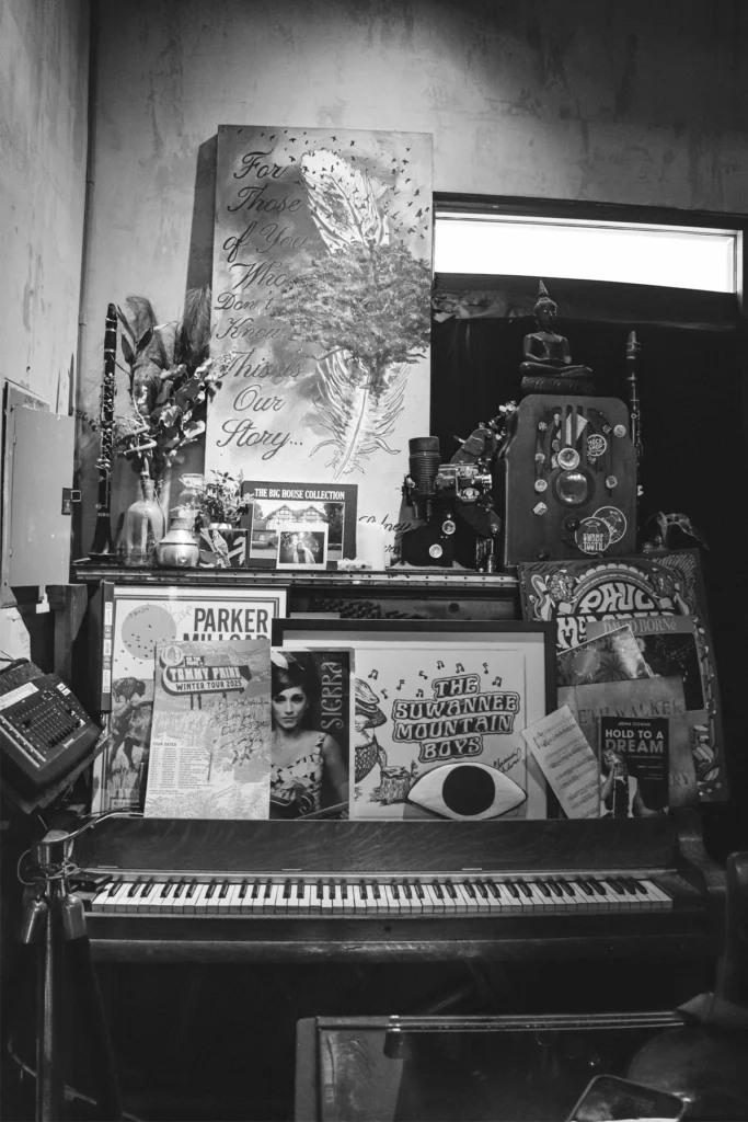 The Blue Jay Listening Room: Where to Catch Live Music in Jacksonville Beach 2 Music memorabilia and vinyl records on a wall in Blue Jay Listening Room.