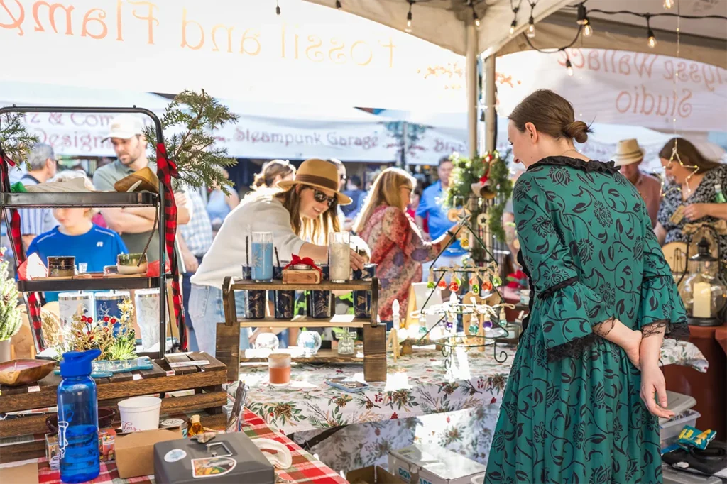 A craft vendor at Dickens on Centre.
